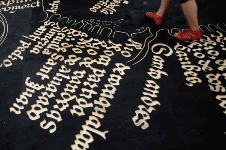 People walking on the wooden map of Mexico City